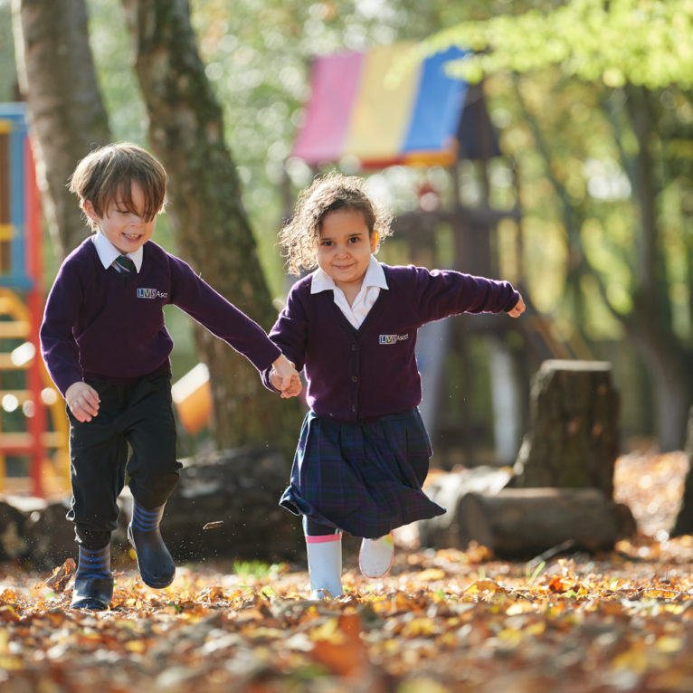 Junior school students playing together