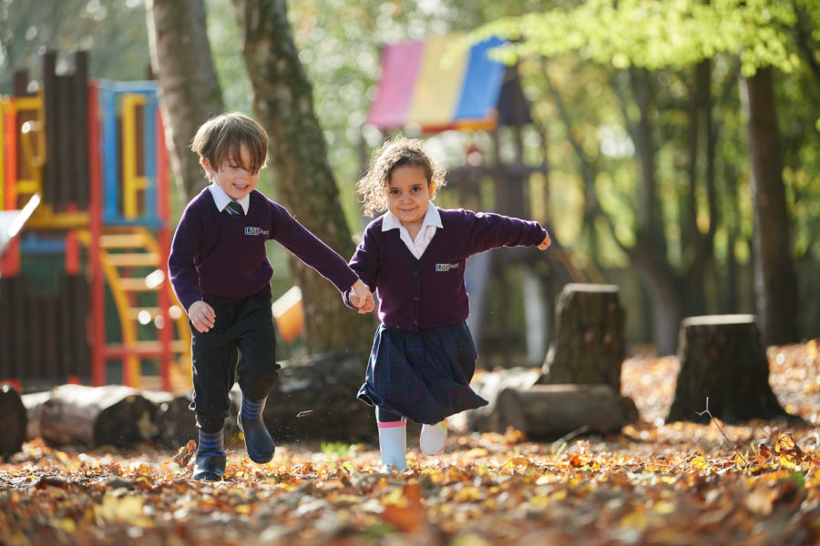 Junior school students playing together