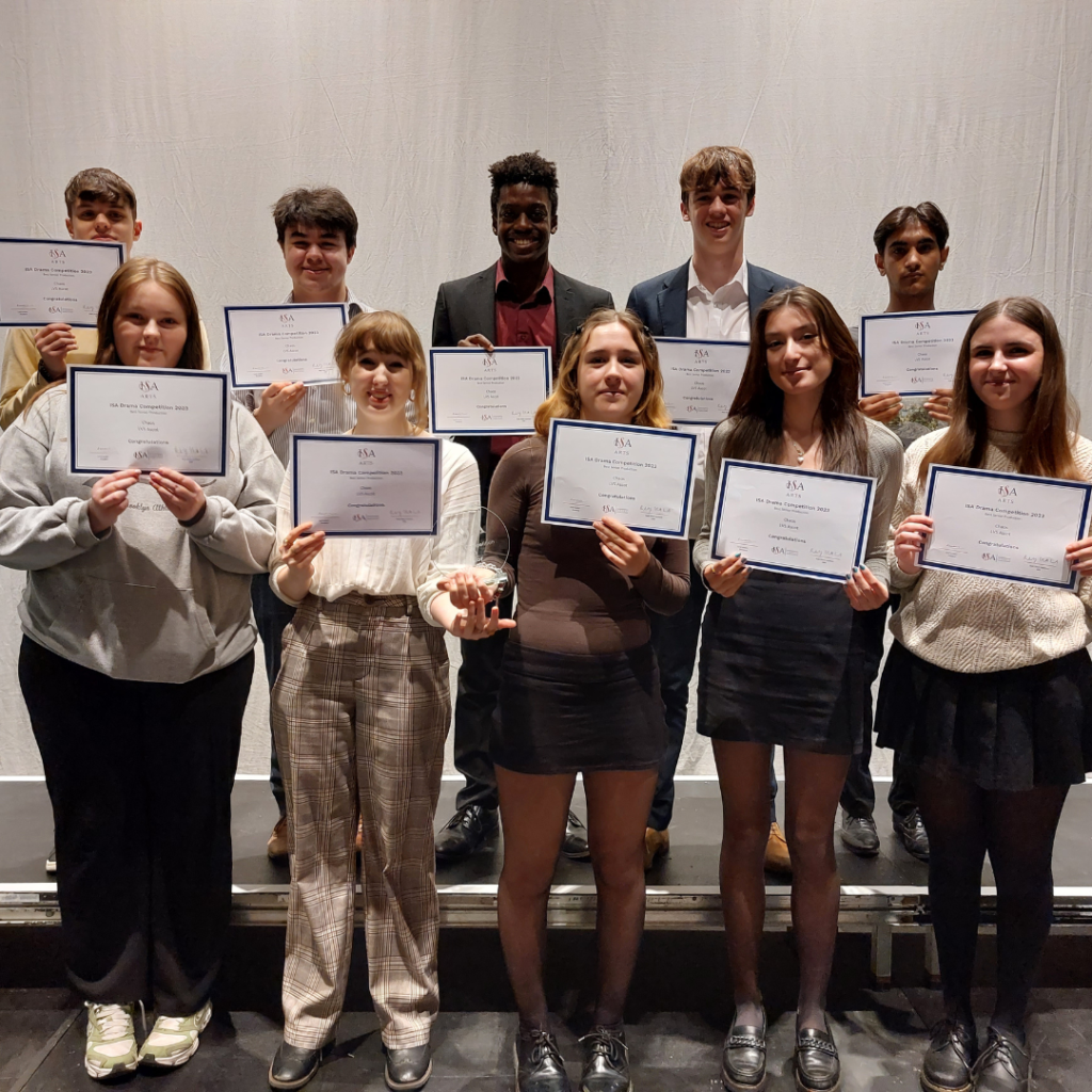 year 12 ISA Drama Competition winners stand with their trophy and certificates