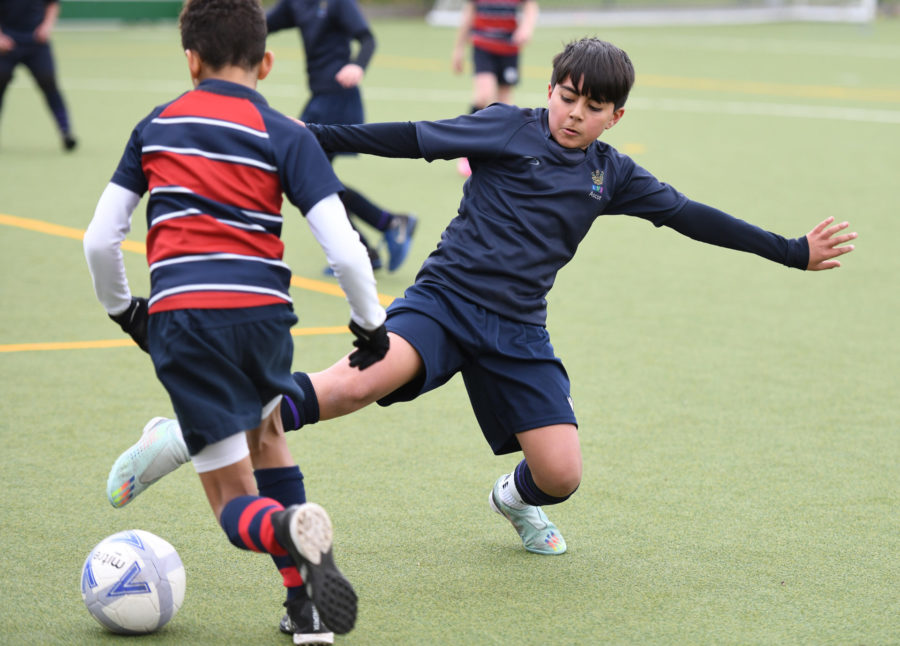 senior school student playing football